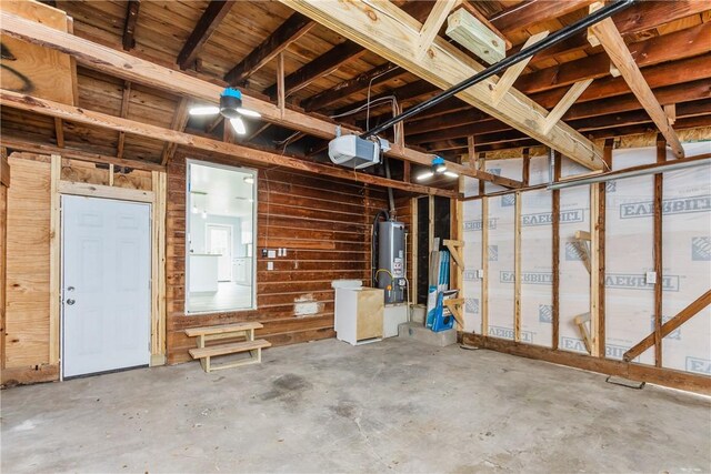 1336 Brentwood Dr, Corpus Christi, TX 78415 - basement featuring gas water heater, wooden walls, and a garage