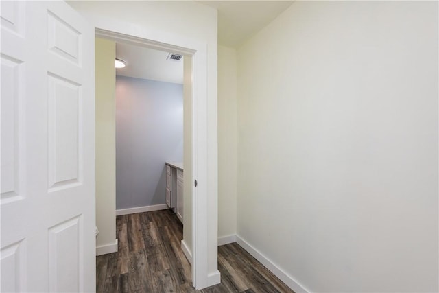 1336 Brentwood Dr, Corpus Christi, TX 78415 - hallway with dark wood-type flooring and baseboards