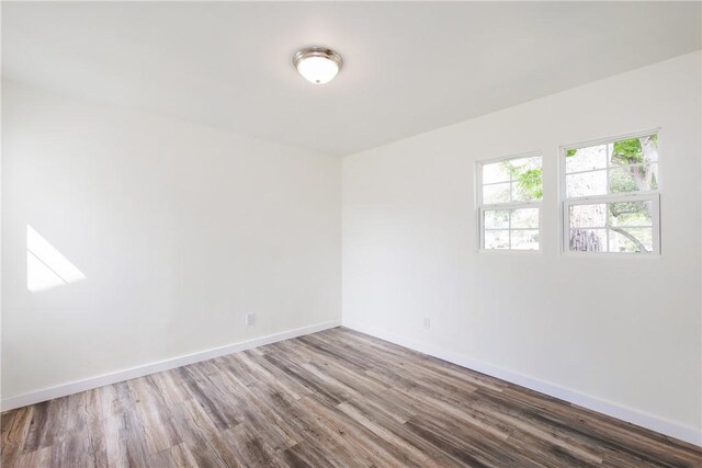 1336 Brentwood Dr, Corpus Christi, TX 78415 - spare room featuring wood finished floors and baseboards