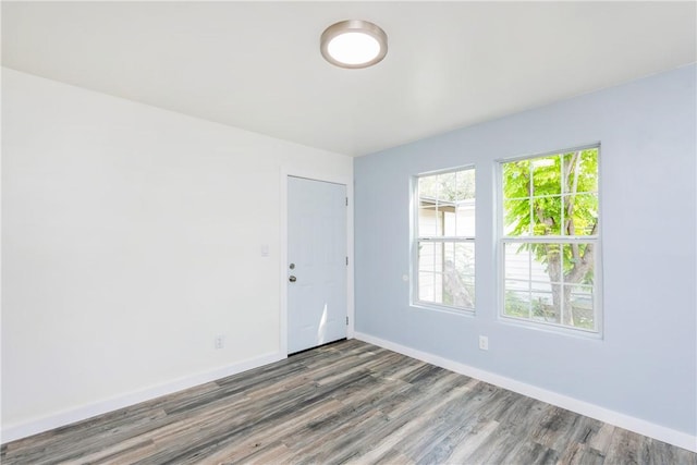 1336 Brentwood Dr, Corpus Christi, TX 78415 - spare room featuring wood finished floors and baseboards