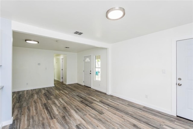 1336 Brentwood Dr, Corpus Christi, TX 78415 - unfurnished living room featuring wood finished floors and baseboards