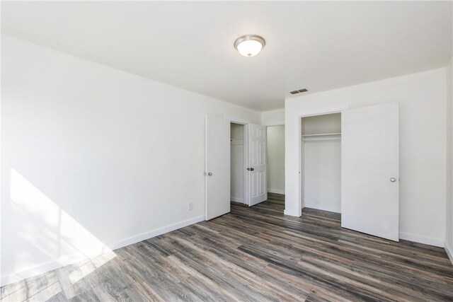 1336 Brentwood Dr, Corpus Christi, TX 78415 - unfurnished bedroom with wood finished floors, baseboards, and a closet