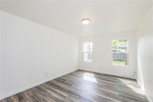 1336 Brentwood Dr, Corpus Christi, TX 78415 - empty room with wood finished floors and baseboards