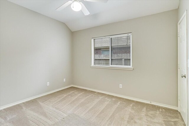 7206 Spanish Wood Dr, Corpus Christi, TX 78414 - unfurnished bedroom with lofted ceiling, a ceiling fan, baseboards, and light colored carpet