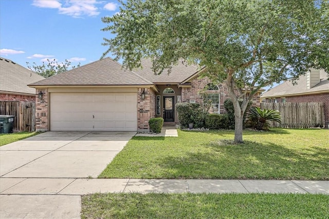7206 Spanish Wood Dr, Corpus Christi, TX 78414 - view of front facade featuring brick siding, fence, driveway, and a garage