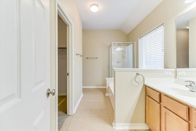 7206 Spanish Wood Dr, Corpus Christi, TX 78414 - full bathroom with a shower stall, vaulted ceiling, tile patterned floors, a spacious closet, and vanity