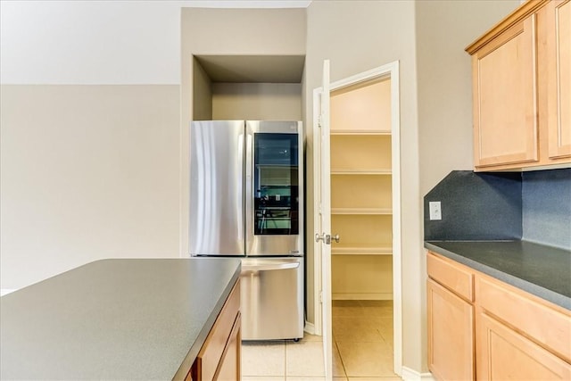 7206 Spanish Wood Dr, Corpus Christi, TX 78414 - kitchen with smart refrigerator, light brown cabinetry, dark countertops, and light tile patterned floors