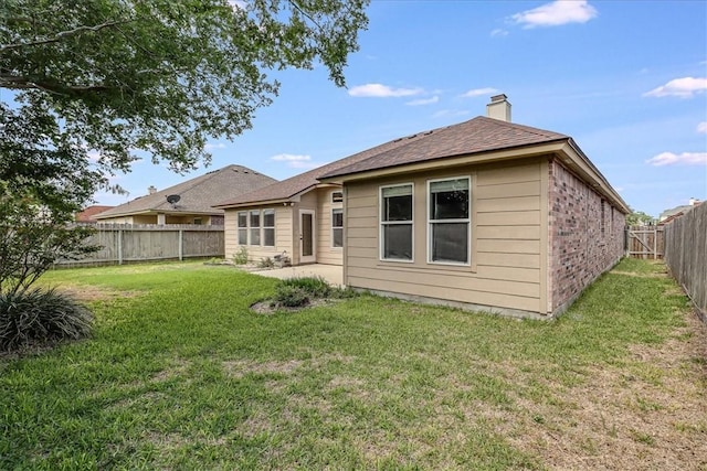 7206 Spanish Wood Dr, Corpus Christi, TX 78414 - back of property featuring a lawn, a chimney, and a fenced backyard