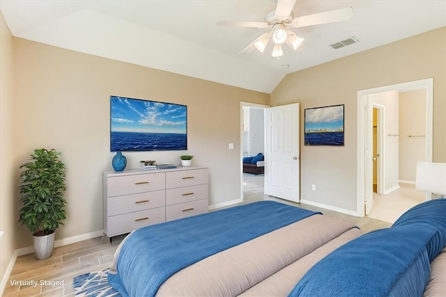 7206 Spanish Wood Dr, Corpus Christi, TX 78414 - bedroom with vaulted ceiling, visible vents, a ceiling fan, light wood-style floors, and baseboards