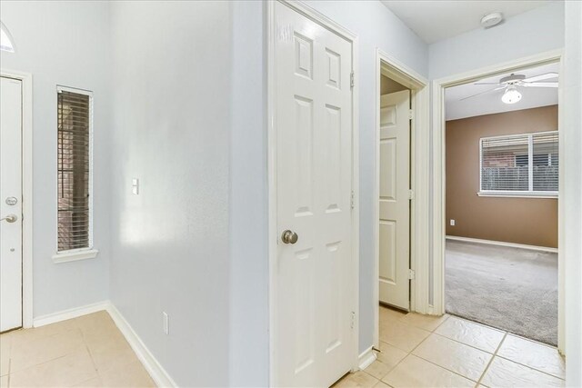 7206 Spanish Wood Dr, Corpus Christi, TX 78414 - hall with light colored carpet, baseboards, and light tile patterned flooring