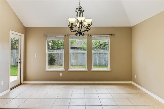 7206 Spanish Wood Dr, Corpus Christi, TX 78414 - unfurnished dining area with lofted ceiling, plenty of natural light, baseboards, and a chandelier