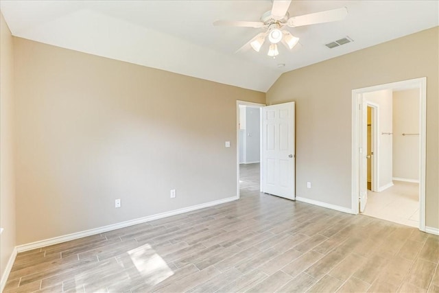 7206 Spanish Wood Dr, Corpus Christi, TX 78414 - unfurnished bedroom with vaulted ceiling, visible vents, light wood finished floors, and baseboards