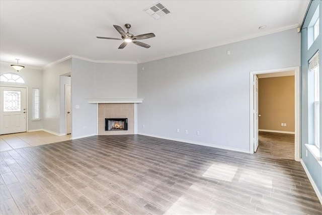 7206 Spanish Wood Dr, Corpus Christi, TX 78414 - unfurnished living room featuring a ceiling fan, crown molding, light wood-type flooring, baseboards, and visible vents