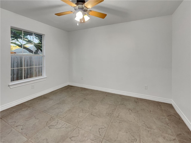 spare room with ceiling fan