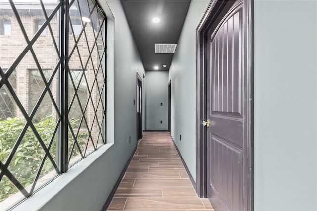 hall with dark hardwood / wood-style floors