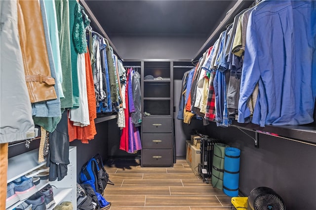 walk in closet featuring hardwood / wood-style flooring