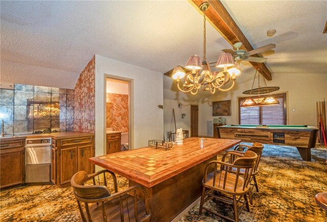5490 County Road 73, Robstown, TX 78380 - kitchen with a textured ceiling, brown cabinetry, wooden counters, billiards table, and a chandelier