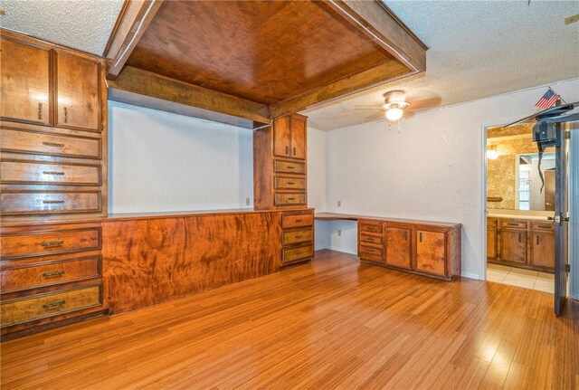 5490 County Road 73, Robstown, TX 78380 - empty room with light wood-type flooring, a textured ceiling, and a ceiling fan