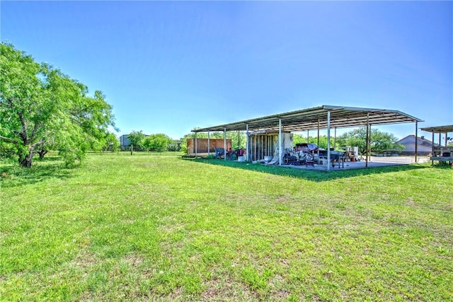 5490 County Road 73, Robstown, TX 78380 - view of grassy yard featuring a carport