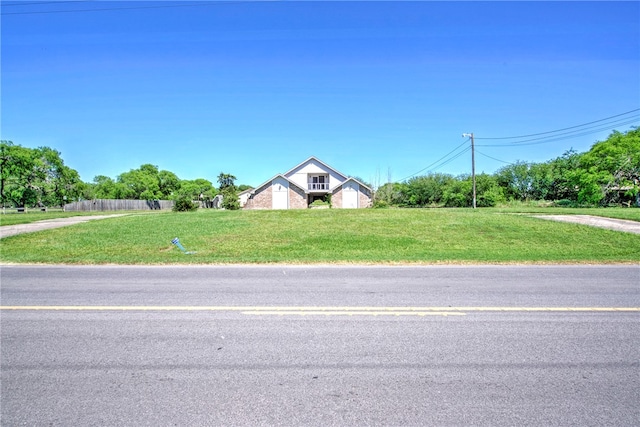 view of front of home featuring a front lawn