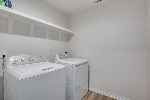 2721 Excelsior Blvd, Corpus Christi, TX 78415 - washroom featuring separate washer and dryer and light wood-type flooring