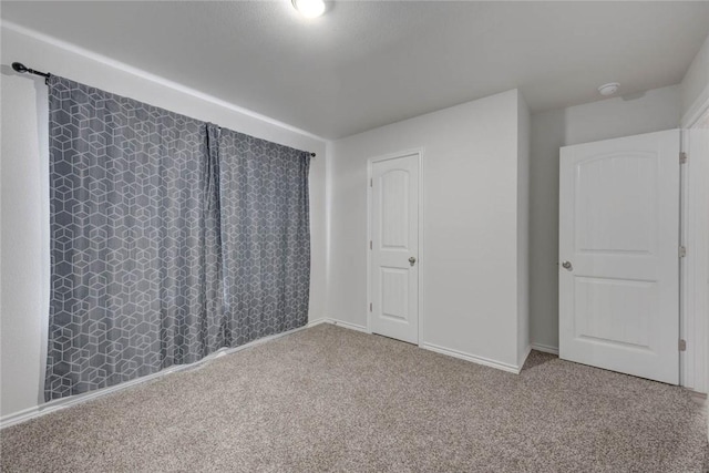 2721 Excelsior Blvd, Corpus Christi, TX 78415 - unfurnished bedroom with carpet and baseboards