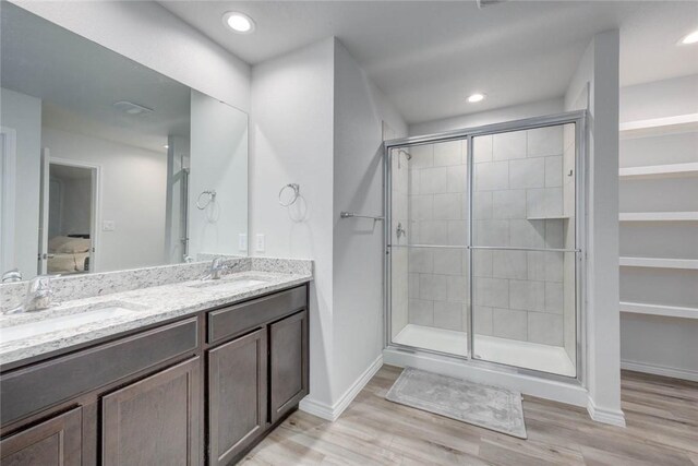 2721 Excelsior Blvd, Corpus Christi, TX 78415 - full bath with a shower stall, double vanity, wood finished floors, and recessed lighting