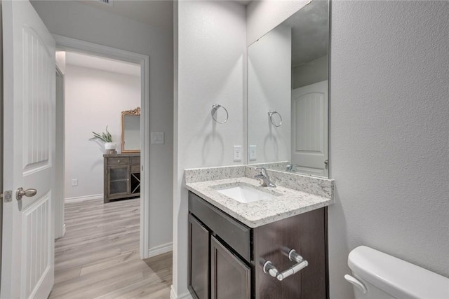 2721 Excelsior Blvd, Corpus Christi, TX 78415 - bathroom featuring wood finished floors and vanity
