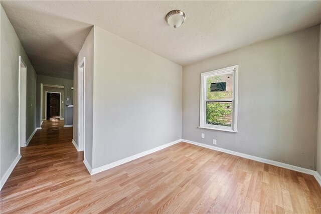 spare room featuring light hardwood / wood-style flooring