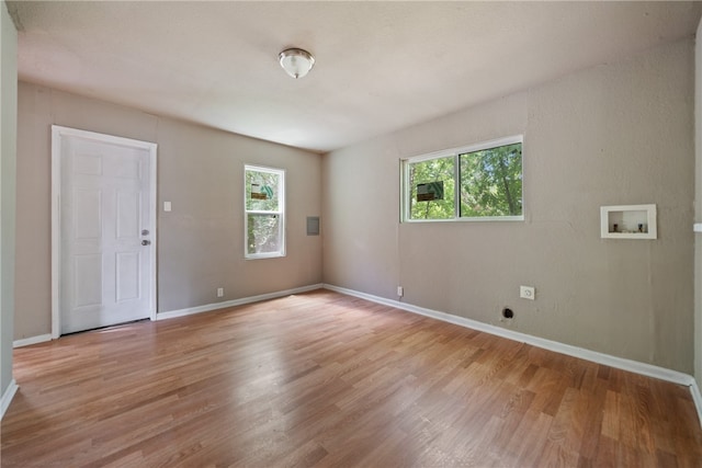 spare room with light hardwood / wood-style floors