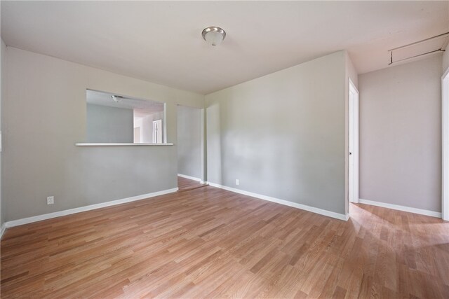 spare room featuring light hardwood / wood-style floors