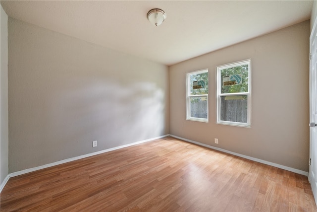 spare room with light wood-type flooring