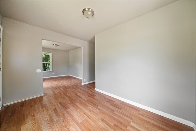 spare room featuring light wood-type flooring