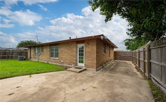 4122 Barnes St, Corpus Christi, TX 78411 - back of property with brick siding, a patio area, a fenced backyard, and driveway