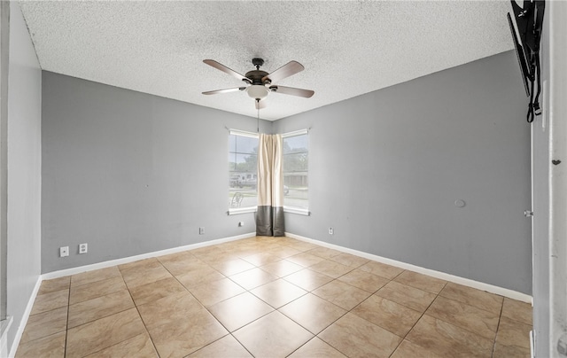4122 Barnes St, Corpus Christi, TX 78411 - tiled empty room featuring a ceiling fan and a textured ceiling