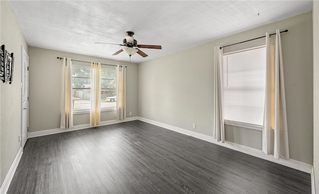 4122 Barnes St, Corpus Christi, TX 78411 - empty room with ceiling fan, dark wood finished floors, and a textured ceiling
