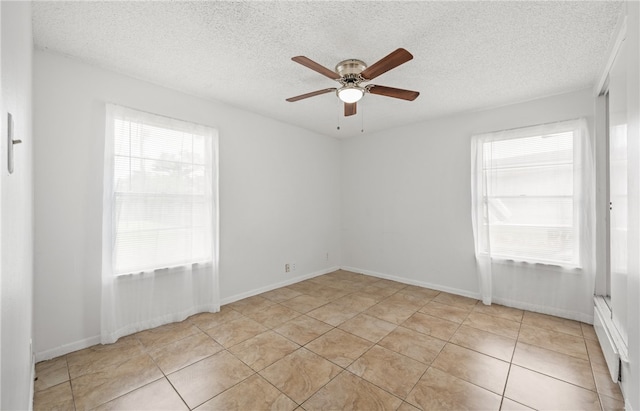 4122 Barnes St, Corpus Christi, TX 78411 - spare room with a textured ceiling, a ceiling fan, and light tile patterned flooring