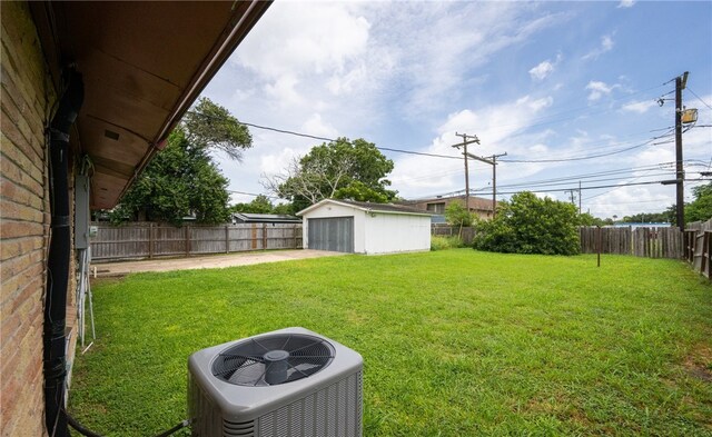 4122 Barnes St, Corpus Christi, TX 78411 - fenced backyard with a detached garage and an outbuilding