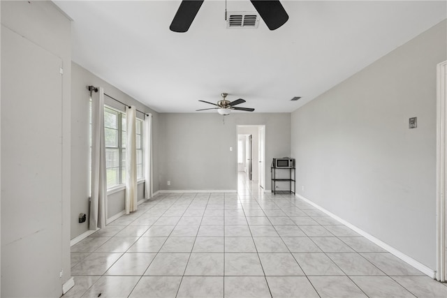 4122 Barnes St, Corpus Christi, TX 78411 - empty room featuring a ceiling fan and light tile patterned flooring