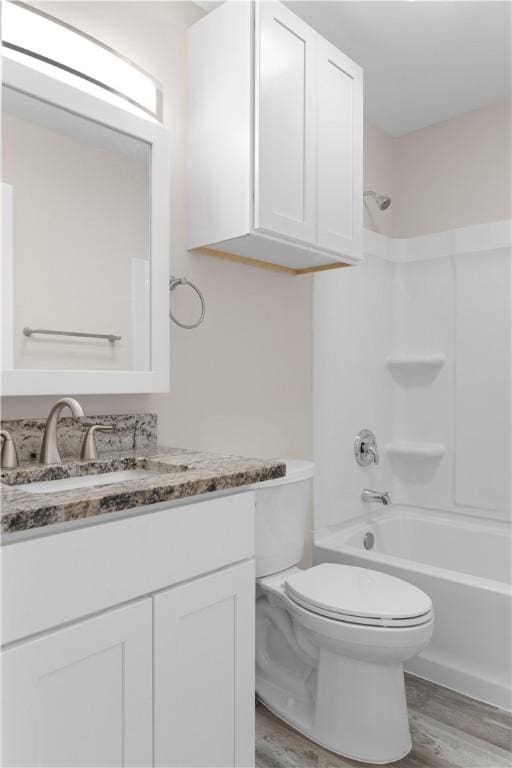 4649 Dodd Dr, Corpus Christi, TX 78415 - full bath with vanity, wood finished floors, and tub / shower combination
