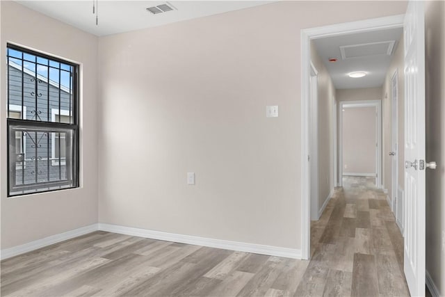 4649 Dodd Dr, Corpus Christi, TX 78415 - empty room featuring light wood-style floors and attic access