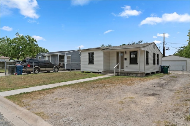 4649 Dodd Dr, Corpus Christi, TX 78415 - view of front facade featuring an outdoor structure and a garage