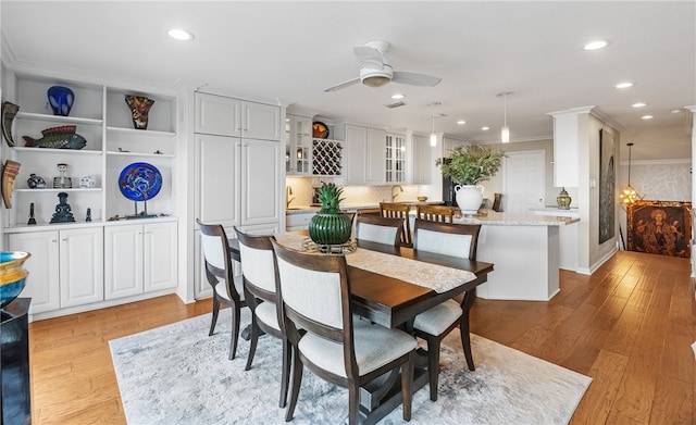 4270 Ocean Dr Unit 11, Corpus Christi, TX 78411 - dining area featuring light wood-style flooring, crown molding, a ceiling fan, and recessed lighting