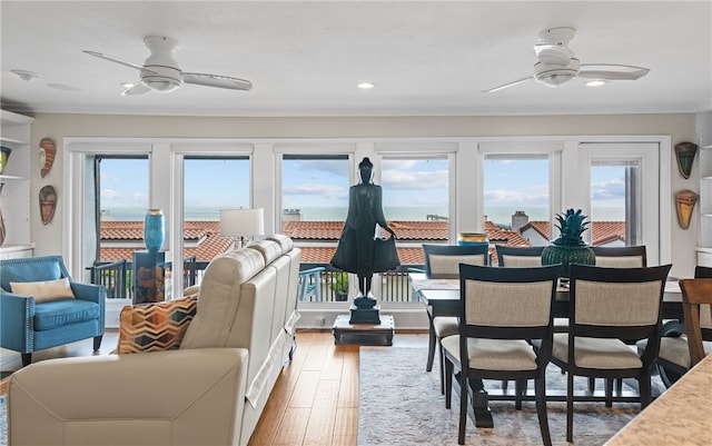 4270 Ocean Dr Unit 11, Corpus Christi, TX 78411 - living area with ceiling fan, healthy amount of natural light, wood finished floors, ornamental molding, and recessed lighting