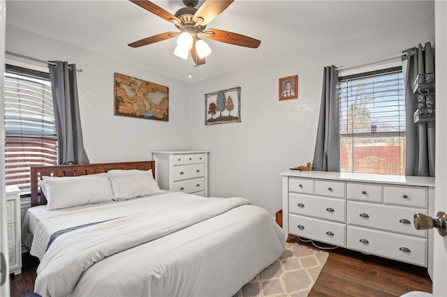 bedroom featuring ceiling fan and dark hardwood / wood-style flooring