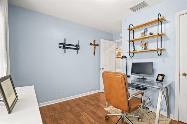 office area with hardwood / wood-style floors