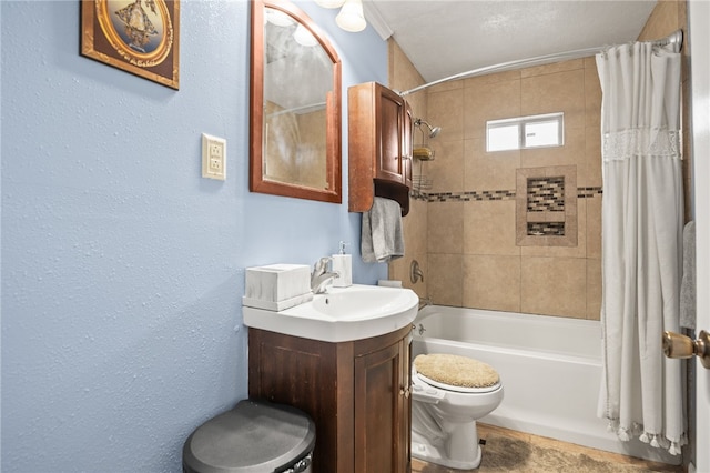 full bathroom with vanity, shower / bath combo, and toilet