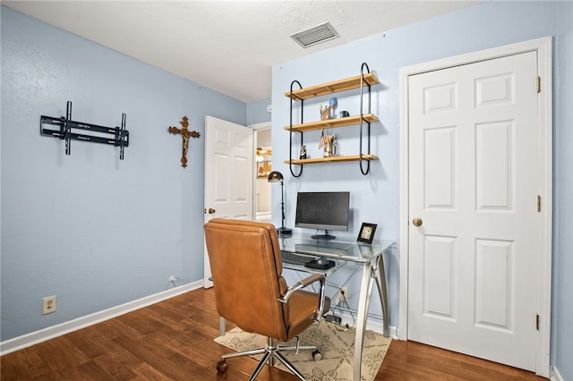 office with dark wood-type flooring