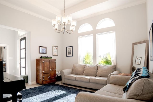 living room featuring a chandelier and ornamental molding