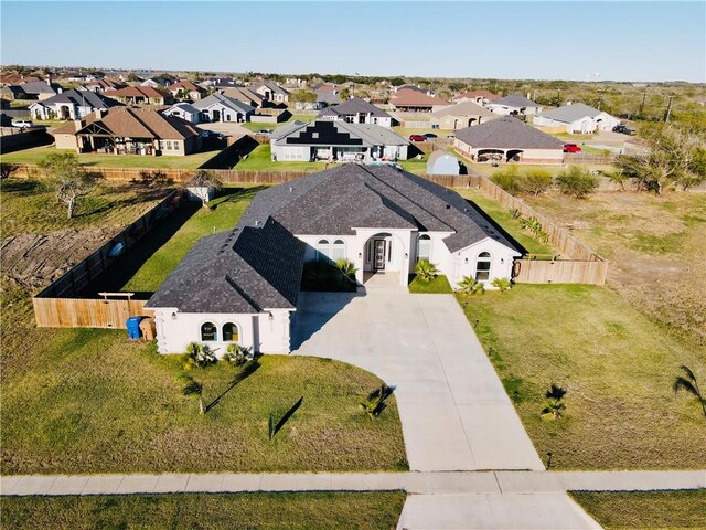 view of front of property featuring a front yard and a garage